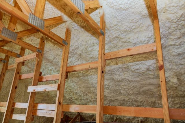 Blown-in cellulose insulation covering an attic floor